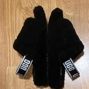 Black fuzzy one strap Ugg slippers